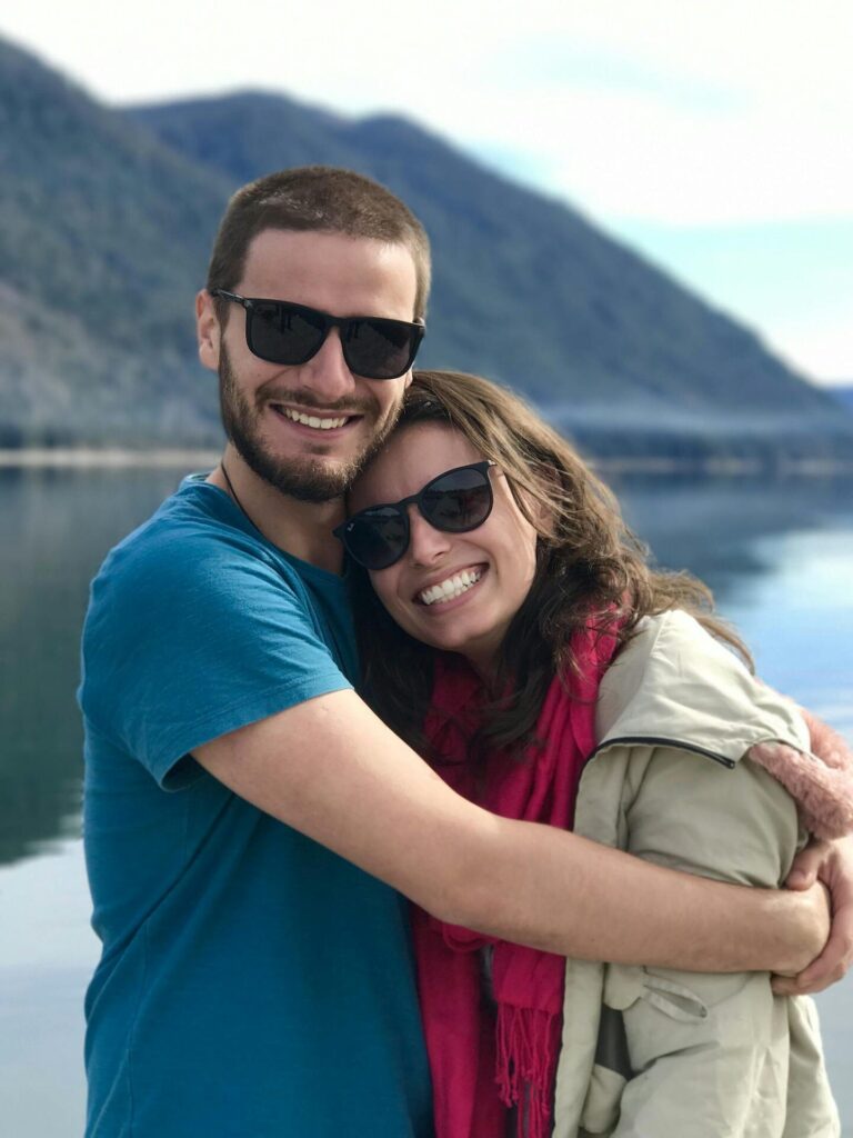 Hugging Couple Near the Body of Water